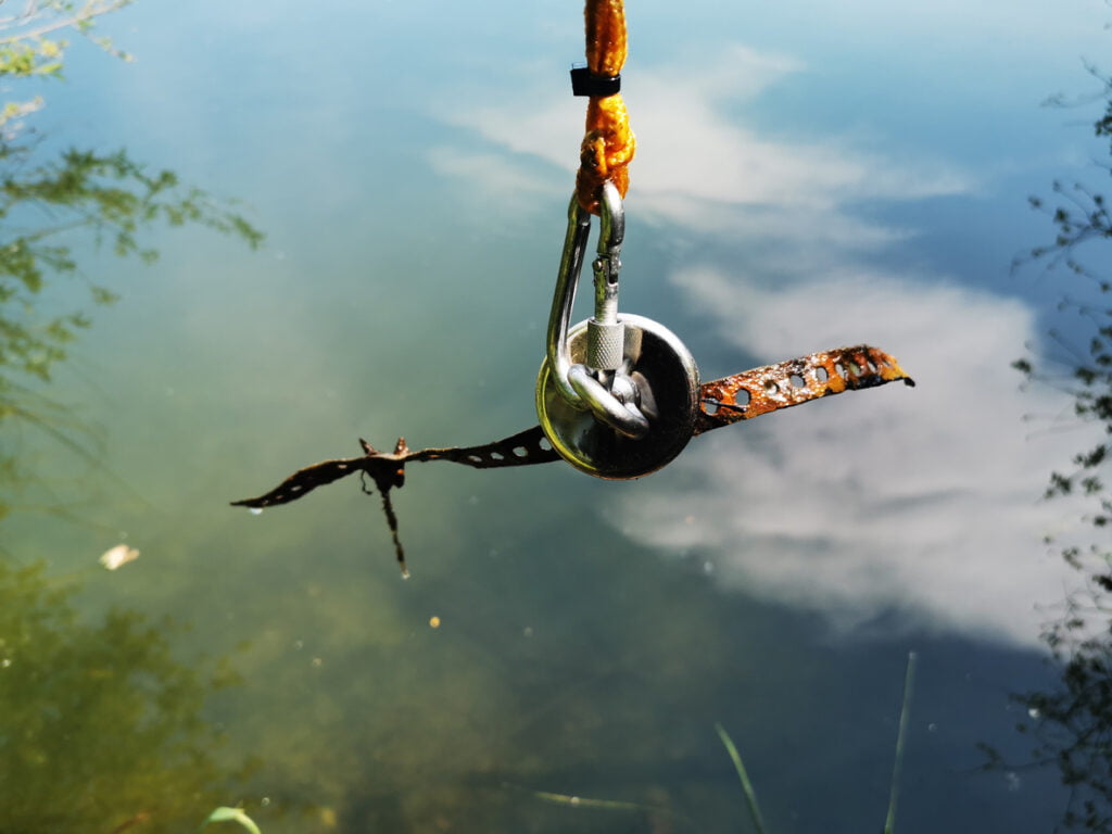 magnet pulling up metal from lake